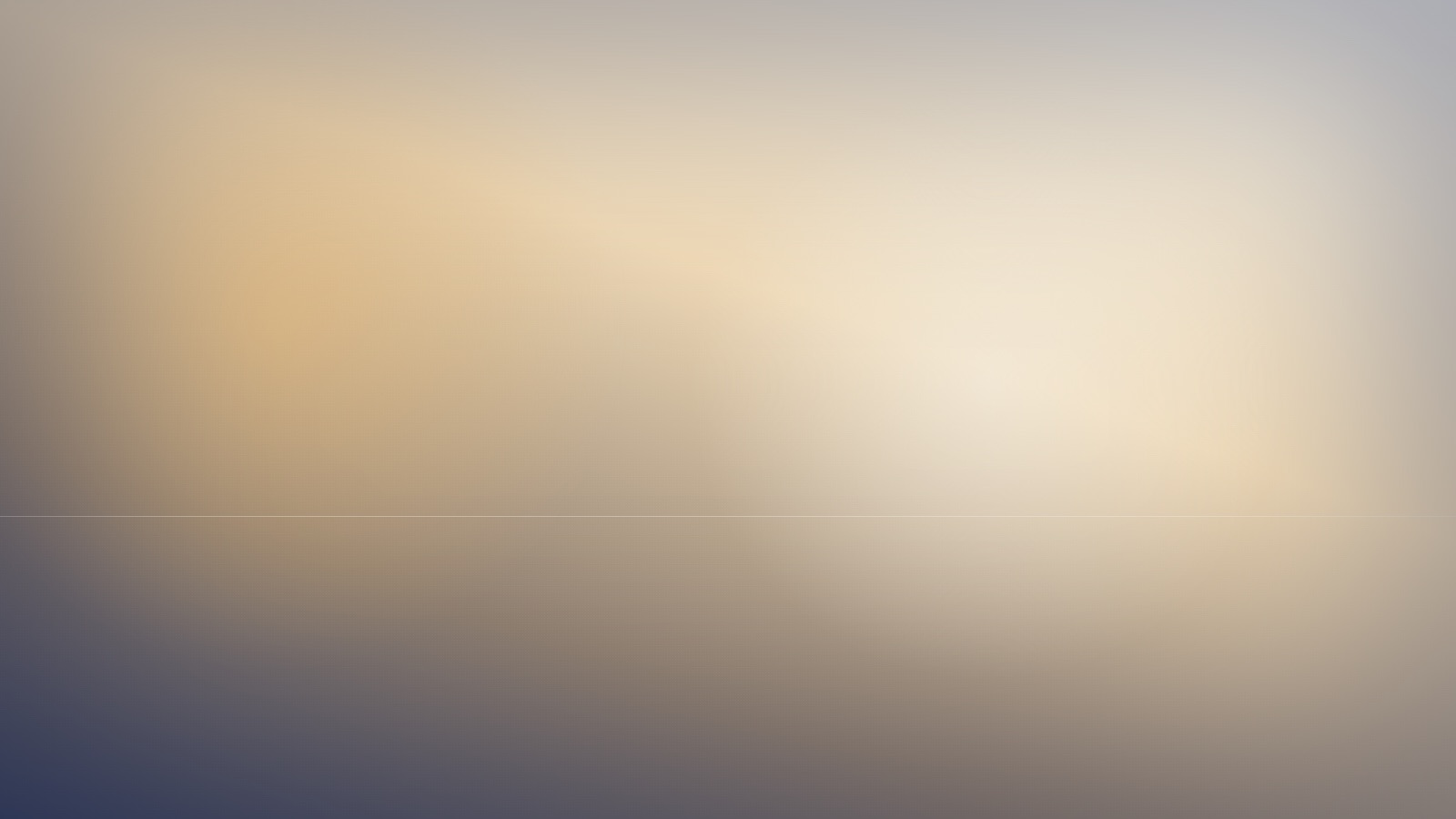 A broad expanse of soft, even colour beneath a still and quiet sky.